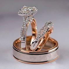 two wedding rings with diamonds on top of each other in gold and silver ring sets