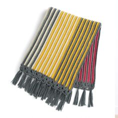 two different colors of fabric with fringes on them