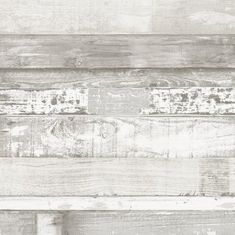 an old wooden wall with peeling paint and chipped wood planks in grey tones