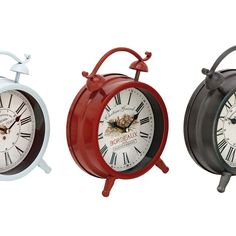 three different styles of clocks are shown side by side, one is red and the other is white