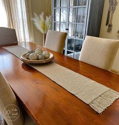 a dining room table with place mats on it