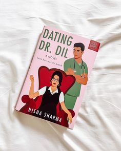 a book about dating with a doctor on top of a white bed sheet that reads, dating dr di