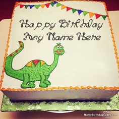 a birthday cake with a green dinosaur on it that says happy birthday to my name here