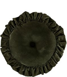 a round pillow with ruffles on the top and bottom in dark green velvet