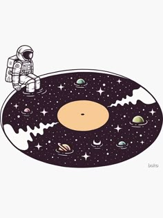 an astronaut sitting on top of a table surrounded by planets