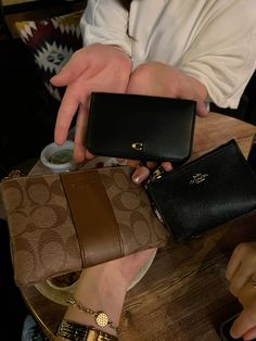 all the girlies equipped with a coach wallet 🤎🥰#aesthetic #inspo #inspiration #tiktok #trend #outfitpinspo #coach #coachwallet #wallet #classic #classy #elegant #coachbag #girls #girlies #girlhood Coach Wallet Aesthetic, Coach Aesthetic, Wallet Aesthetic, Purse Aesthetic, Coach Wallets, Gift Wishlist, Coach Wallet