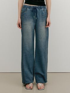 This product, a pair of denim sweat semi-wide banding pants, combines the comfort of sweatpants with the style of denim. They offer a relaxed fit with a modern silhouette, perfect for casual wear. The pants are designed to provide both comfort and a chic look. - These denim sweat semi-wide banding pants are made from high-quality fabric, ensuring durability and a comfortable feel.- The pants feature an elastic waistband with a drawstring for a secure and adjustable fit.- A handmade Cali medal decoration has been attached to the lower right side of the front panel to add a unique point of interest.- The versatile design of these pants makes them easy to pair with various tops, offering a stylish and comfortable option for everyday wear. 2025 Fashion, W Concept, Right Side, Quality Fabric, Casual Wear, Everyday Wear, Sweatpants, Relaxed Fit, Wardrobe