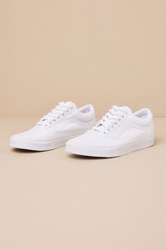 Grab the Vans Old Skool True White Lace-Up Sneakers anytime you want to look casually iconic! Durable canvas fabric and pebbled faux leather come together to shape these must-have kicks with a rounded toe upper and a lace-up vamp with white laces. Signature Sidestripeâ„¢ accents the insole and outsole. Low-cut, padded collar tops a sturdy bumper sole that features the classic waffle outsole! Logo tag at the heel. 1" rubber heel. Cushioned insole. Rubber sole has nonskid markings. Man made materi Classic Leather Vans Sneakers, Vans Everyday Sneakers With Round Toe, Vans Sneakers With Round Toe For Everyday Wear, Vans Everyday Sneakers, Vans Casual Leather Sneakers, Urban Vans Sneakers For Spring, Casual Leather Vans Sneakers, Classic Vans Canvas Sneakers, Casual Leather Canvas Shoes For Spring