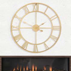 a clock that is on the side of a wall next to a fireplace with flames