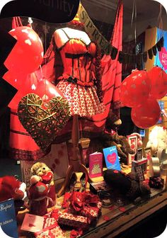 a display case filled with lots of red and white items