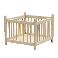 a small wooden crib on a white background