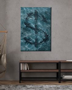 dolphins swimming in the ocean under a blue sky canvas art print on a grey wall