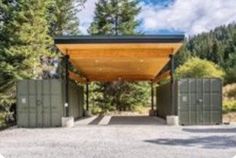 an outdoor covered parking lot surrounded by trees