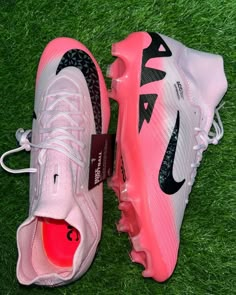 the nike air max sneakers are pink and white with black details on the soles