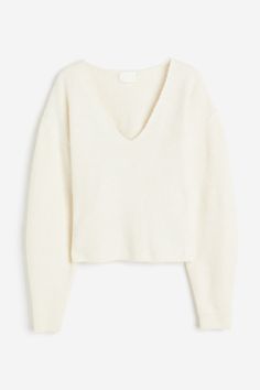 Short  loose-fit sweater in a soft knit. V-neck  dropped shoulders  and long balloon sleeves. Ribbing at neckline and cuffs. Loose Fit Sweater, Cream Sweater, Ribbed Knit Sweater, Dream Clothes, White Sweaters, V Neck Sweater, Soft Knits, Vneck Sweater, Black Sweaters