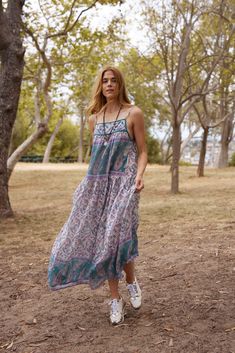 The Betsy Printed Maxi Dress in Teal is a unique and stunning addition to any summer wardrobe. Made from 100% Indian cotton, this dress is designed to be light and flowy, making it perfect for warm weather. The beautiful print adds a touch of bohemian charm, making it a must-have item for the season. With its one size fits all design, this dress is versatile and can fit sizes 2 to 10 comfortably. It is made in India, adding to its authenticity and uniqueness. The teal color adds a pop of color t Casual Flowy Midi Dress For Beach Cover-up, Flowy Casual Midi Dress For Beach Cover-up, Casual Boho Print Sundress As Beach Cover-up, Spring Boho Print Sundress For Beach Cover-up, Flowy Boho Sundress For Beach Cover-up, Flowy Printed Dresses For Beach Cover-up, Casual Boho Dress With Print For Garden Party, Flowy Paisley Print Midi Dress, Flowy Floral Print Midi Dress Beach Cover-up