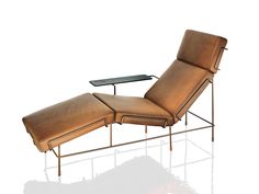 a brown leather chaise lounge chair with a glass table on the bottom and side