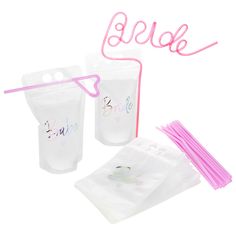 plastic bags with pink straws and the word bride written on them next to each other