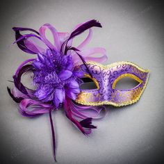 The Venetian Purple Side Mesh Flower Gold Glitter Women Eyes Masquerade Mask Is An Elegant And Mysterious Accessory Perfect For Masquerade Balls And Themed Parties. Featuring A Purple Base With Gold Glitter And A Dramatic Side Mesh Flower, It Offers A Unique Blend Of Traditional And Modern Styles. Designed For Women, It Provides A Comfortable Fit With An Adjustable Ribbon Tie, Adding Glamour And Sophistication To Any Outfit. Made From Glitter And Mesh Flowers This Mask Fits Most Women Comes With Purple Masquerade Mask For Mardi Gras Carnival, Purple Masquerade Mask For Carnival, Purple Eye Mask For Costume Party, Purple Masquerade Mask For Mardi Gras, Purple Masquerade Mask, Harlequin Mask, Women Eyes, Mesh Flowers, Masquerade Costumes