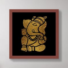 an elephant with a crown on it's head sitting in front of a wall