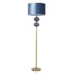 a floor lamp with a blue shade on it