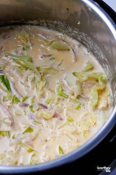 the soup is prepared and ready to be cooked in the crock pot on the stove