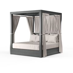 a canopy bed with curtains and pillows on it