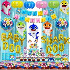 a baby shark birthday party with balloons and decorations