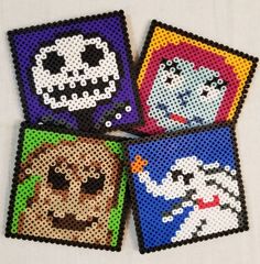 four beaded coasters with pictures of dogs and cats on them, all decorated in different colors