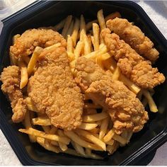 fried chicken and french fries in a plastic container