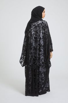 Elevate your style with this luxurious black abaya set. Adorned with delicate floral lace and hand-stitched embellishments, the farasha design is sure to make a statement. Perfect for any occasion, this set is a must-have for those who want to add a touch of elegance and glamour to their wardrobe. Fabric - Premium High Grade Polyester Hijab is included Long Sleeve Inner Slip Dress is included Stud Fasteners allows you to wear the farasha open or closed Hand stitched Embellishments all over the abaya Model is a UK dress size 8, height of 5'8, wearing a size 58 Dry Clean Only Fitted Floor-length Embellished Abaya, Traditional Black Embellished Abaya, Black Abaya With Floral Embroidery, Embellished Black Floor-length Abaya