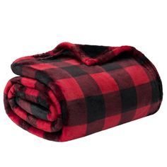 the red and black plaid blanket is folded up