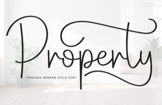 the word property written in cursive writing on a white wall next to a potted plant