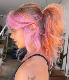 For those who can’t decide on just one color, the two-tone hair trend offers the best of both worlds. This trend involves blending two contrasting colors, such as black and white, or pastel pink and lavender, to create a striking and unique look. Blonde Sunset Hair, Colorful Hair For Blondes, Statement Hair Color, Colors With Blonde Hair, Pink Hair Ideas For Blondes, Blonde Hair With Color Peekaboos Summer, Blonde And Colorful Hair, Vivid Hair Color Ideas Blondes, Cool Hair Color Ideas For Blondes