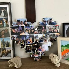 a wooden table topped with pictures and photos