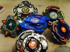 several different types of toys sitting on top of a wooden table next to each other