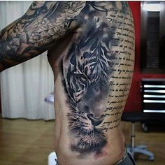 a man with a tiger tattoo on his back