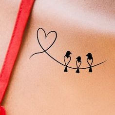 three birds sitting on a wire with heart shaped stickers attached to the back of it