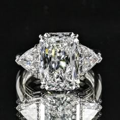 a fancy diamond ring with three diamonds on it