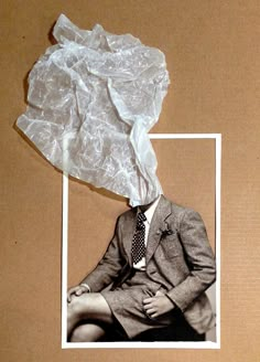 an old photo of a man in a suit and tie with plastic wrap around his head