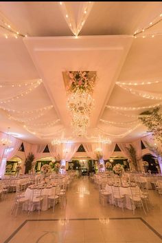 the inside of a banquet hall with tables and chairs