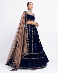 Navy blue without sleeve blouse paired with double tier lehnga and tissue dupatta.From Vvani Vats Mahnoor collection.DELIVERY TIMEPlease allow 8-12 weeks for your outfit to arrive.FABRIC DETAILSVelvet, TissueProfessional cleaning only. Luxury Royal Blue Lehenga For Diwali, Luxury Royal Blue Anarkali Set For Festive Occasions, Luxury Royal Blue Anarkali Dupatta, Luxury Designer Royal Blue Lehenga, Luxury Velvet Women's Choli, Luxury Blue Semi-stitched Traditional Wear, Luxury Indigo Festive Dupatta, Zardozi Art Navy Blue Dress, Luxury Blue Choli For Eid