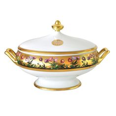 a white bowl with gold trimming and flowers on it