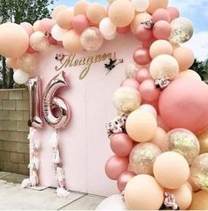 an instagram photo with balloons on it and the number six balloon arch in front