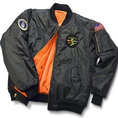 an orange and black jacket with patches on it