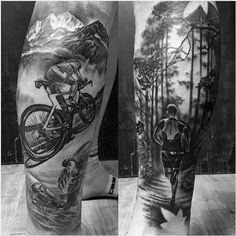 two mens legs with mountain and bicycle tattoos on them