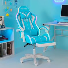 a blue and white office chair sitting in front of a computer desk