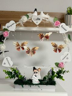 a wedding cake topper with butterflies and flowers