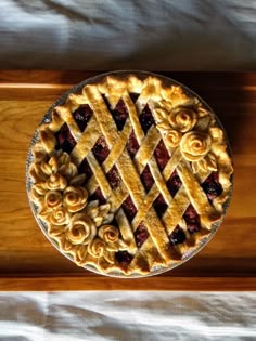 a pie sitting on top of a wooden table