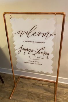 a welcome sign with the words simple love written in cursive writing on it